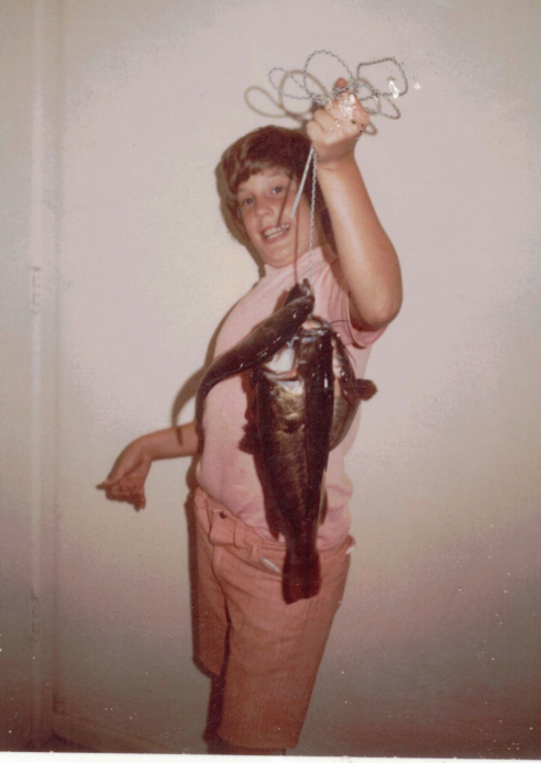 Randy at 12 with fish, showing right hand